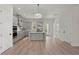 Spacious kitchen with gray cabinetry, stainless appliances, large island and light wood floors at 1615 Macoma Rd, Mount Pleasant, SC 29466
