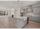 Bright, open-concept kitchen with a large island, stainless steel appliances, and views to the living room at 1615 Macoma Rd, Mount Pleasant, SC 29466