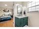Bathroom with updated vanity, faucet, and lighting; ' bedroom visible in background at 176 Hainsworth Dr, North Charleston, SC 29418
