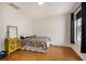 Bright bedroom features hardwood floors, large window, and white walls at 176 Hainsworth Dr, North Charleston, SC 29418