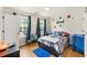 Cozy bedroom offers natural light from the window and hardwood floors at 176 Hainsworth Dr, North Charleston, SC 29418