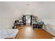 Large bonus room with sloped ceiling, hardwood floors, window, and storage at 176 Hainsworth Dr, North Charleston, SC 29418