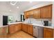 Well-lit kitchen featuring wooden cabinets, stainless steel appliances, and quartz countertops at 176 Hainsworth Dr, North Charleston, SC 29418