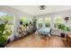 Bright sun room with many windows and plants at 176 Hainsworth Dr, North Charleston, SC 29418