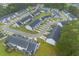 Aerial view of a well-planned community with townhouses surrounded by lush landscaping and winding roads at 178 Buchanan Cir, Goose Creek, SC 29445
