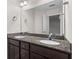 Modern bathroom features a granite countertop with dual sinks, dark wood cabinets, and ample space at 178 Buchanan Cir, Goose Creek, SC 29445