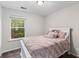 Cozy bedroom featuring neutral walls and a window with a view of a vibrant outdoor setting at 178 Buchanan Cir, Goose Creek, SC 29445