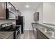 Well-equipped kitchen with granite counters, stainless steel appliances and wooden cabinets at 178 Buchanan Cir, Goose Creek, SC 29445