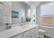Well-lit bathroom boasts a pristine white vanity, ample counter space, and tasteful decorative accents at 183 Country Gate Lane Ln, Summerville, SC 29485