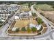 Aerial view of the community center which includes a green space, walking paths, and multiple buildings at 183 Country Gate Lane Ln, Summerville, SC 29485