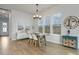 Dining room featuring a wooden table with chairs, complemented by stylish decor and ample natural light at 183 Country Gate Lane Ln, Summerville, SC 29485
