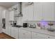 Bright kitchen features stainless appliances, quartz countertops, and ample cabinet space at 183 Country Gate Lane Ln, Summerville, SC 29485