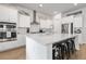 Stylish kitchen with white cabinets, a large island with seating, stainless steel appliances, and wood flooring at 183 Country Gate Lane Ln, Summerville, SC 29485