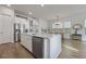 Bright, open kitchen with an island, stainless steel appliances, and wood floors at 183 Country Gate Lane Ln, Summerville, SC 29485