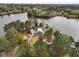 Aerial view of the lake house featuring a private drive, lake access, and mature trees at 183 Country Gate Lane Ln, Summerville, SC 29485