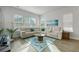 Bright living room with a sectional sofa, an area rug, and natural light at 183 Country Gate Lane Ln, Summerville, SC 29485