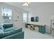 Modern living room featuring ample seating, built-in desk, and natural light at 183 Country Gate Lane Ln, Summerville, SC 29485