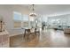 Open-concept living space combines a dining area with a rustic table and a bright living room with comfortable seating at 183 Country Gate Lane Ln, Summerville, SC 29485