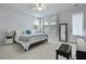 Bright main bedroom featuring neutral decor, a ceiling fan, and a full-length mirror at 183 Country Gate Lane Ln, Summerville, SC 29485