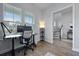 Bright office featuring a modern desk setup with a large monitor and views of the staircase and entryway at 183 Country Gate Lane Ln, Summerville, SC 29485
