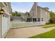 View of the fenced backyard, featuring a white picket fence and a detached garage at 1833 Hubbell Dr, Mount Pleasant, SC 29466