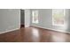 Bright bedroom features hardwood floors, neutral walls, and a walk-in closet at 1833 Hubbell Dr, Mount Pleasant, SC 29466