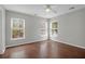 Bright bedroom with hardwood floors, ceiling fan and multiple windows at 1833 Hubbell Dr, Mount Pleasant, SC 29466