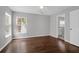 Well-lit bedroom with hardwood floors and a view of a palm tree at 1833 Hubbell Dr, Mount Pleasant, SC 29466