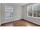 Well-lit bedroom with hardwood floors and multiple windows at 1833 Hubbell Dr, Mount Pleasant, SC 29466