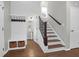 Entryway featuring storage, a coat rack and stylish hardwood floors leading to the staircase at 1833 Hubbell Dr, Mount Pleasant, SC 29466