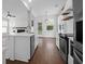 Modern kitchen features white cabinetry, stainless steel appliances, and open layout at 1833 Hubbell Dr, Mount Pleasant, SC 29466