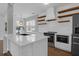 Beautiful kitchen with quartz counters, stainless appliances, and stylish hood at 1833 Hubbell Dr, Mount Pleasant, SC 29466