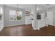 Bright kitchen and dining area featuring stylish lighting and floating shelves at 1833 Hubbell Dr, Mount Pleasant, SC 29466