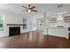 Spacious living room boasts fireplace, ceiling fan and access to the kitchen at 1833 Hubbell Dr, Mount Pleasant, SC 29466
