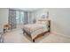 Bright bedroom with a brown leather bed frame, patterned bedding, and neutral walls at 185 Red Bluff St, Summerville, SC 29483