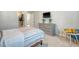 This bright bedroom showcases a bed, dresser, and television at 185 Red Bluff St, Summerville, SC 29483