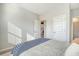 Serene bedroom with natural light showcases a cozy bed and neutral decor at 185 Red Bluff St, Summerville, SC 29483