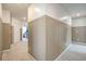 A hallway with decorative wainscotting and carpet at 185 Red Bluff St, Summerville, SC 29483