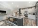 Bright, modern kitchen with large island, seating, and stainless steel appliances at 185 Red Bluff St, Summerville, SC 29483