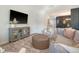 Cozy living room featuring modern decor, a large TV, and inviting seating arrangements at 185 Red Bluff St, Summerville, SC 29483