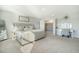 Large, carpeted main bedroom with a walk-in closet, vanity, and soft gray walls at 185 Red Bluff St, Summerville, SC 29483
