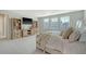 Spacious main bedroom featuring a seating area, a built-in display case, and neutral tones at 185 Red Bluff St, Summerville, SC 29483