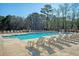 Inviting community pool with comfortable lounge chairs, creating a perfect oasis for relaxation and social gatherings at 185 Red Bluff St, Summerville, SC 29483