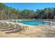 Resort-style community pool with lounge chairs, promising endless relaxation and summertime fun for residents at 185 Red Bluff St, Summerville, SC 29483