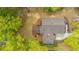 Birds eye view of the house showing the roof, yard, and nearby mature trees at 1883 Hall Point Rd, Mount Pleasant, SC 29466