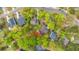 Aerial perspective of the property showing the roof, yard, surrounding foliage, and proximity to other houses at 1883 Hall Point Rd, Mount Pleasant, SC 29466
