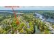 Aerial view of 1883 Hall Point Rd, showcasing the property's location amidst lush greenery and waterfront scenery at 1883 Hall Point Rd, Mount Pleasant, SC 29466