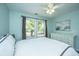 Bright bedroom with two windows and neutral bedding creating a tranquil and inviting atmosphere at 1883 Hall Point Rd, Mount Pleasant, SC 29466