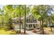 Attractive home with a welcoming front porch, lush landscaping, and an attached two-car garage at 1883 Hall Point Rd, Mount Pleasant, SC 29466