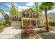 Beautiful home with a cozy front porch, attached garage, and lush landscaping in a desirable neighborhood at 1883 Hall Point Rd, Mount Pleasant, SC 29466